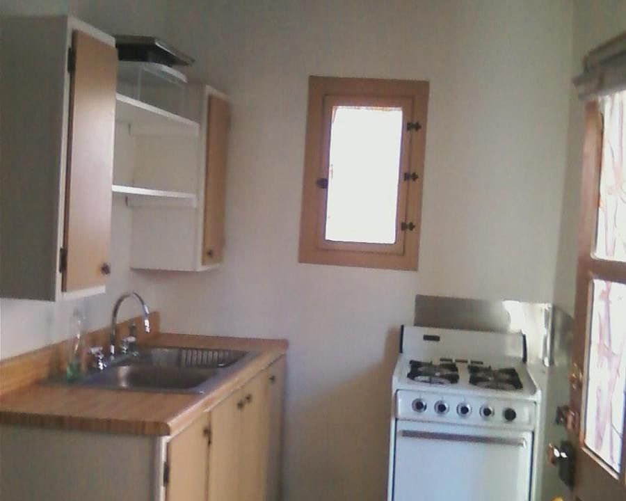 Kitchen has stove and sink