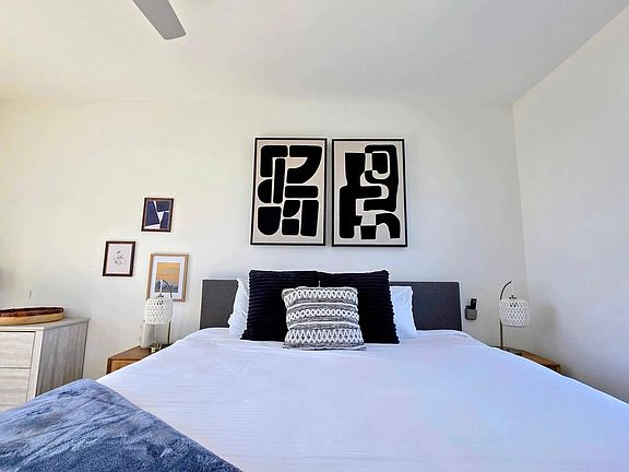 Bedroom 1 (king bed, AC, ceiling fan, TV, balcony)