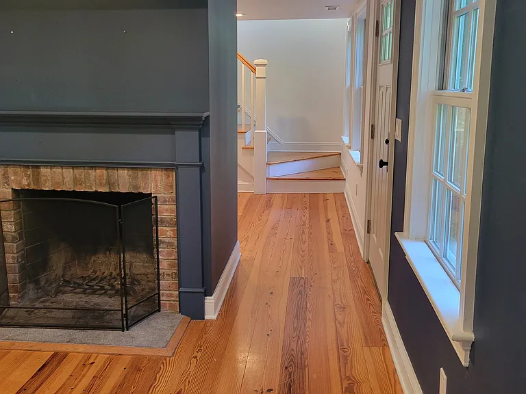 Hall between living room and dining room, front door in the middle