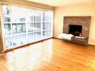 Bright dining area adjacent to kitchen with the sliding door to backyard patio