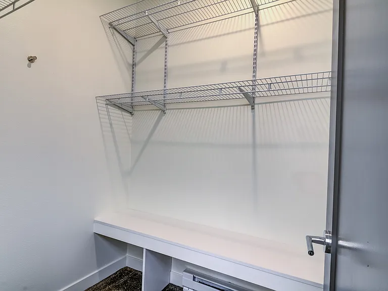 adjustable shelving in one bedroom walk-in closets