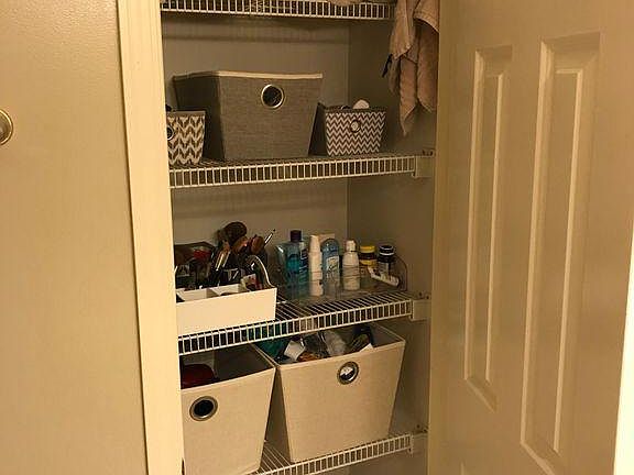Storage closet in bathroom