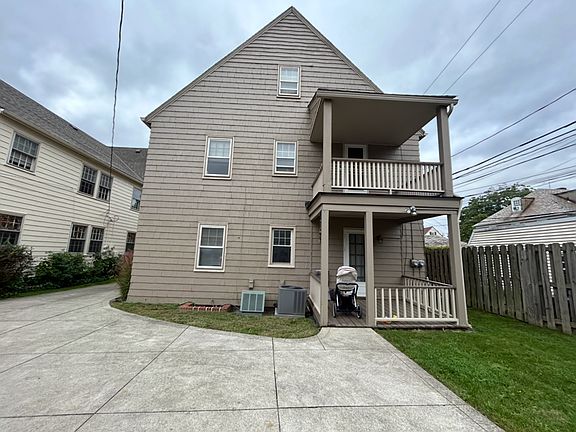 The back of the duplex. The upper deck is for this unit. There is shared green space.