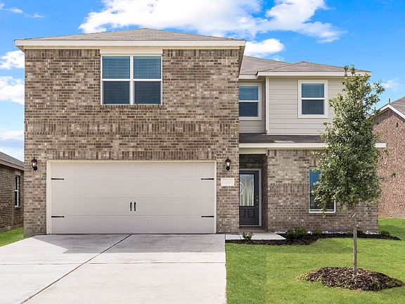 The Driftwood is a beautiful two-story floor plan with a brick exterior.