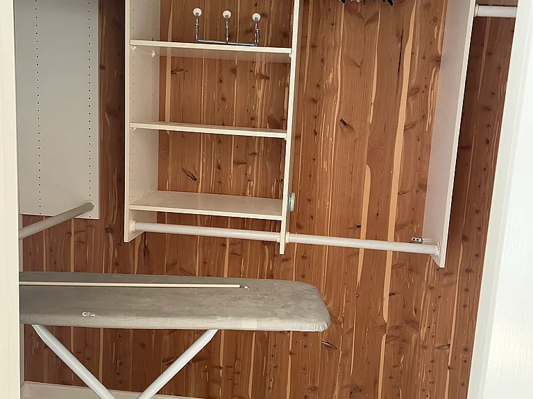 One of the two primary suite closets. This is a walk in cedar closet.