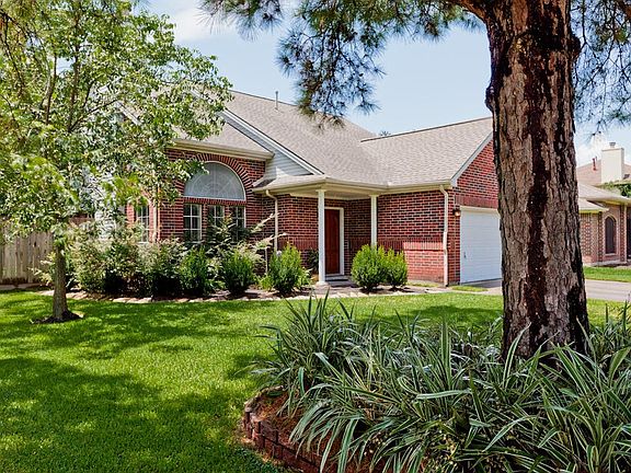 Corner lot with a mature pine tree in the front yard.