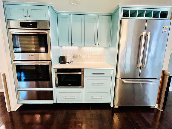 Chef's Kitchen with Bosch Appliances. Double ovens, warming drawer, built in microwave, refrigerator and freezer. 
Second refrigerator/freezer in garage.
