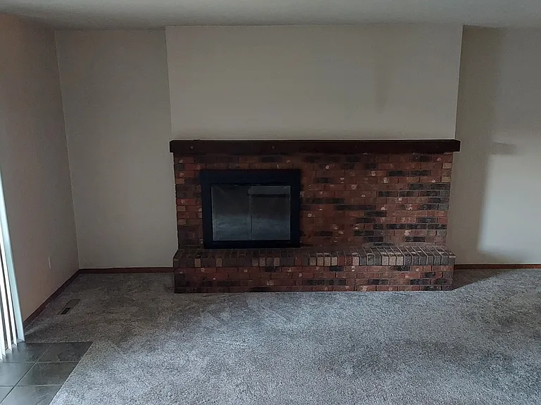 Newer Carpet, Gas Fireplace, Sliders to Backyard & Deck.