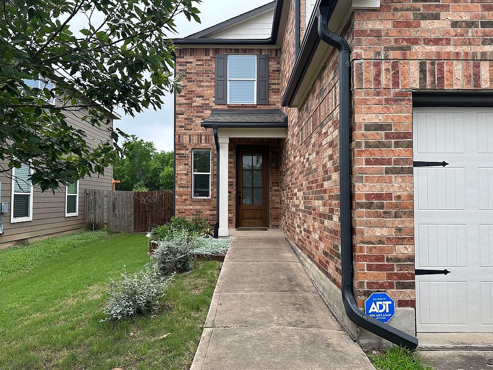 Landscaped front yard with charming front door
