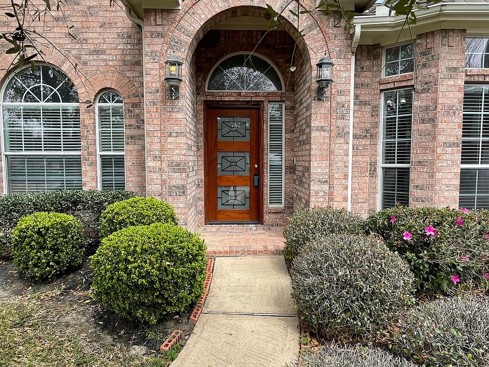 Beautiful one-story brick home on a quiet cul-de-sac with a welcoming covered front porch and 3-car garage.