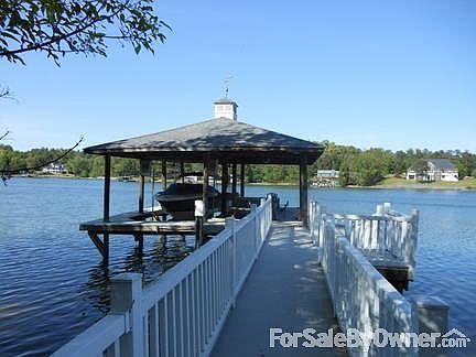 Boat dock.
						:
						Boat dock also has covered sitting area with picnic table and lounge chairs