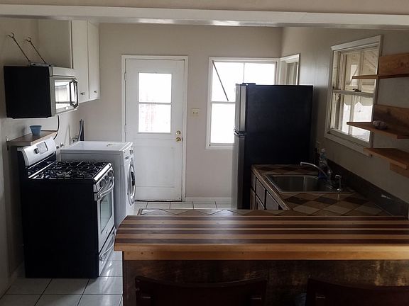 peeking inside the kitchen over the handcrafted bartop