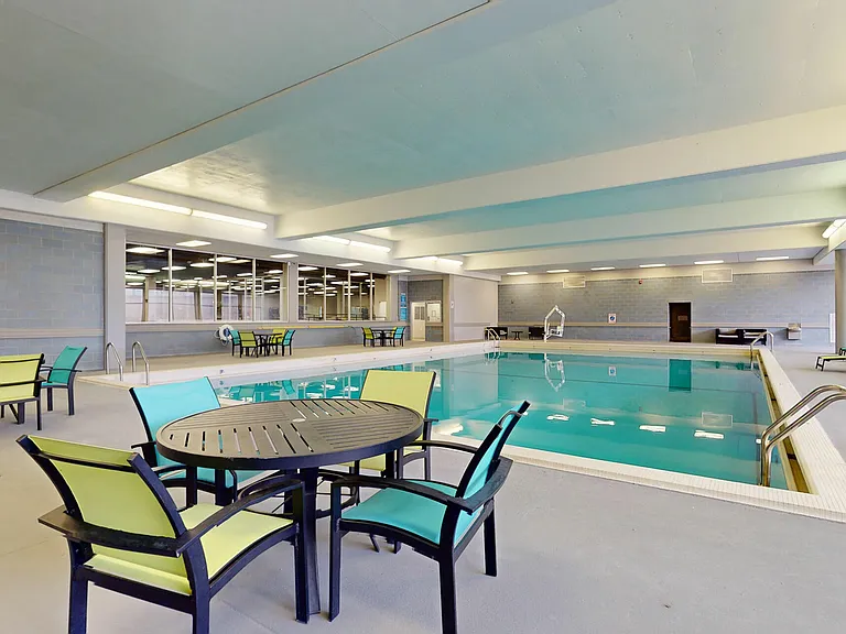 Indoor Pool and Relaxing Deck at University Plaza NIU Apartments