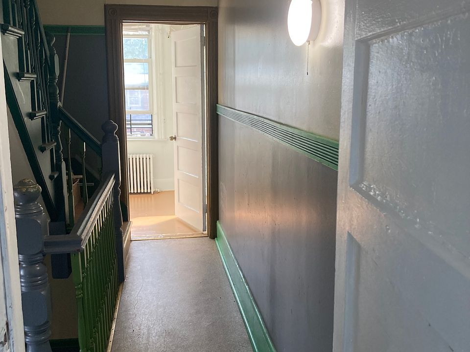 Full hallway with two doors to the rooms