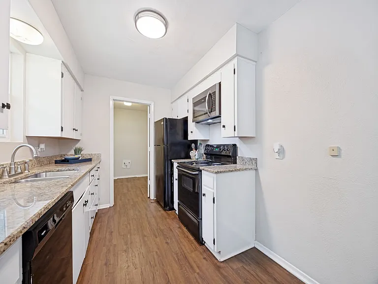Adorable kitchen with all major appliances and the utility room off of the kitchen