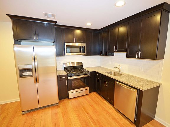 Kitchen w granite counters and SS Appliances