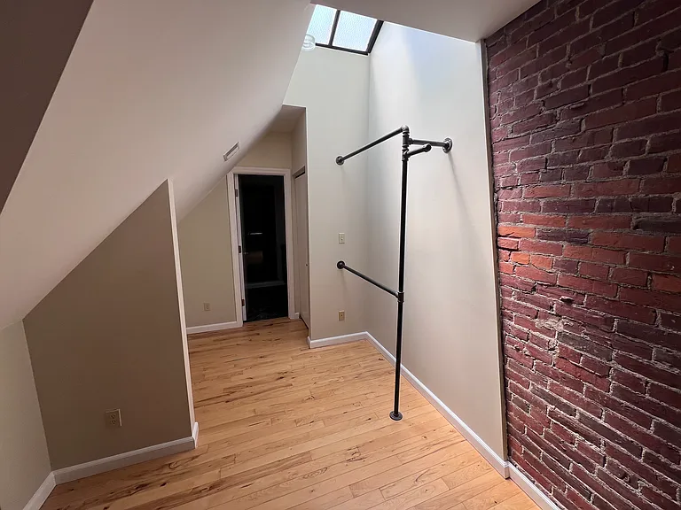 Second floor bedroom hanging rack for additional storage
