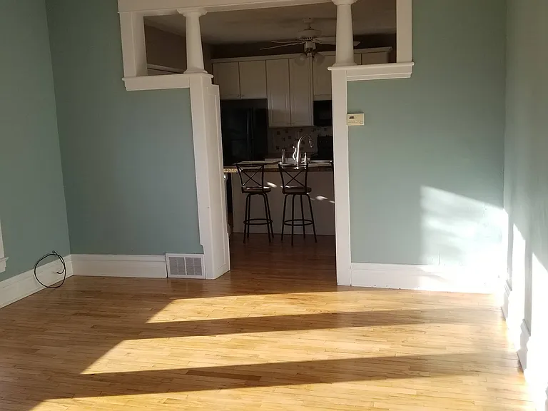 Living room, view into kitchen