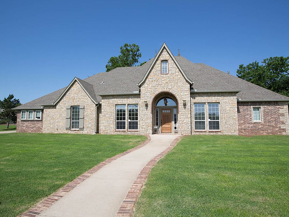 Sidewalk Leading to Partial Brick & Stone Country French Home