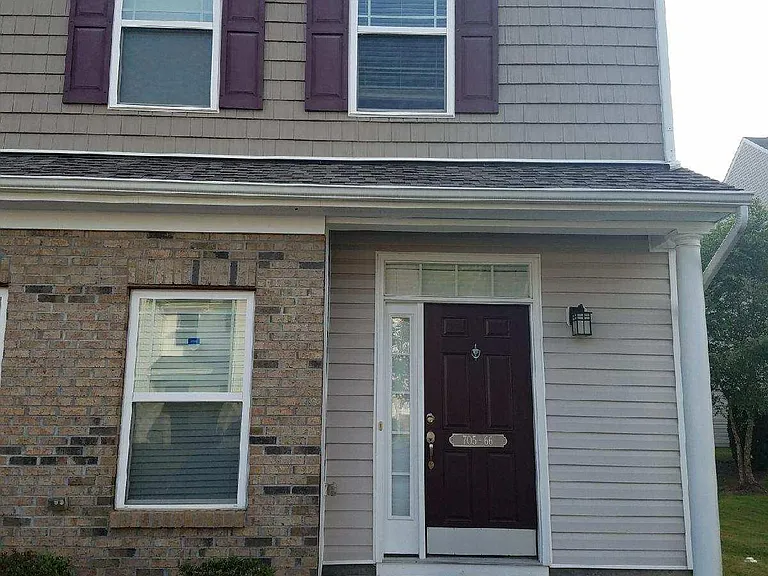 Front of house. Picture taken from the 2 designated parking space in front of house