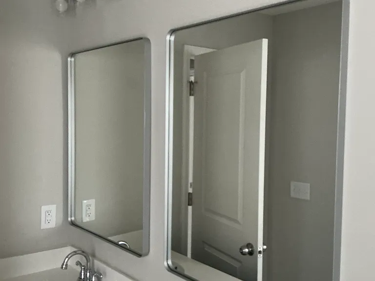 Secondary bathroom with double vanity and tub