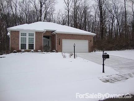 Front with view of woods
						:
						HOA covers snow removal, mulching, feritizling, grass mowing, trimming, trash
