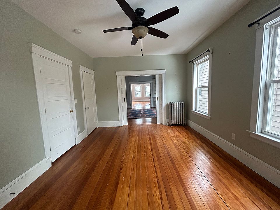 Master bedroom with open pocket doors provides all natural light