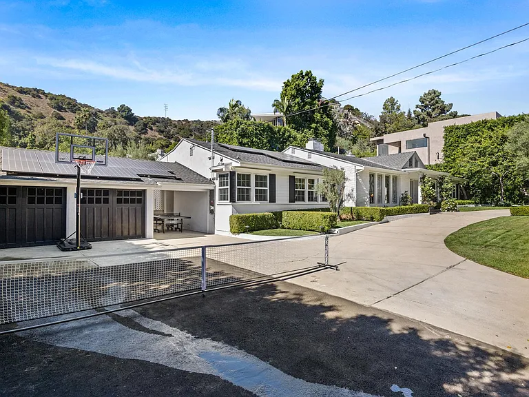 Step into a versatile play zone equipped with an extended tennis court and a basketball net.
