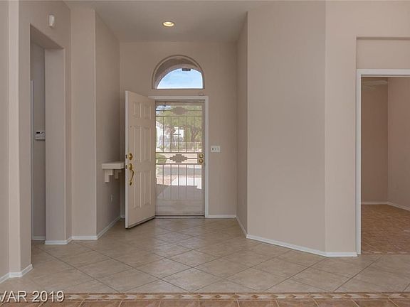 LIGHT AND BRIGHT FOYER WITH TILE THRU-OUT MAIN LIVING AREA