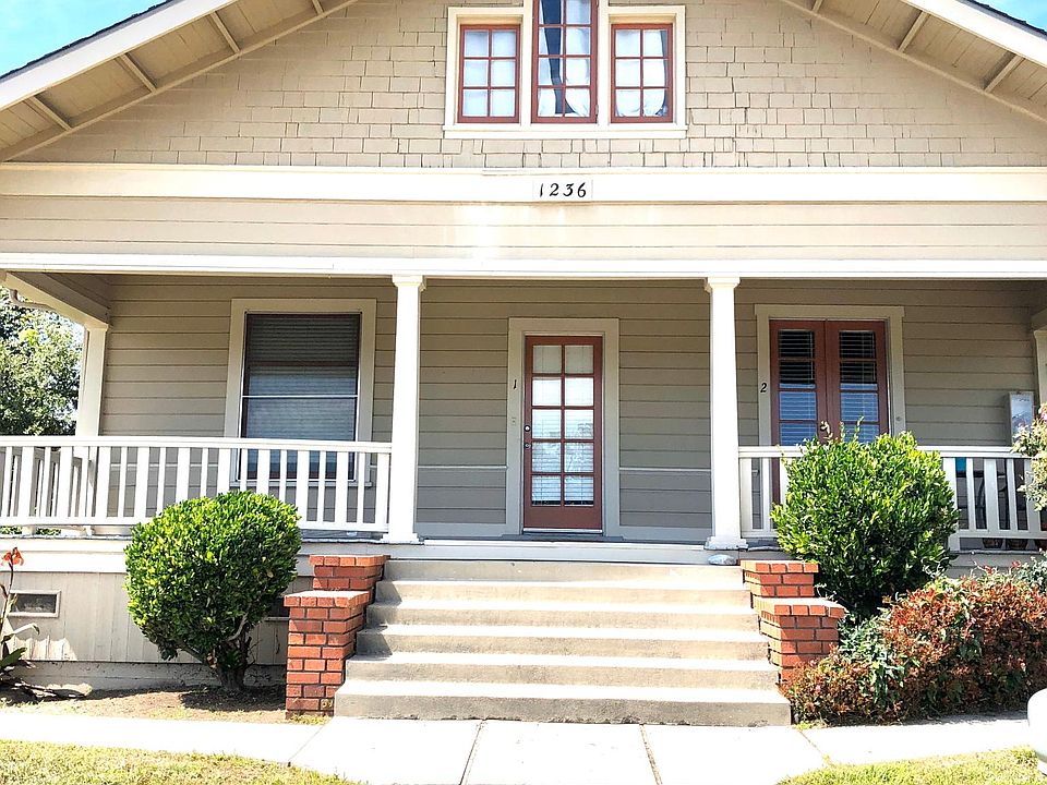 The front of the main portion of the house. Large 1920_s craftsman that has been divided into 4 separate units