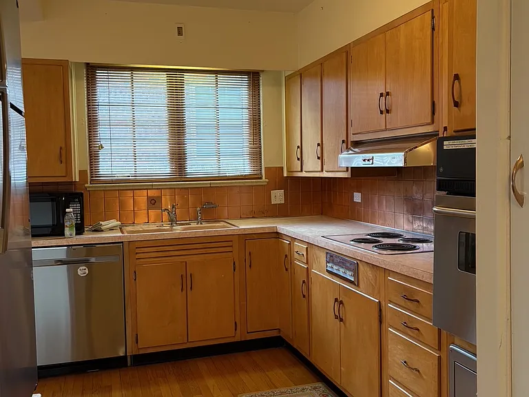 Another view of kitchen with copper backsplash