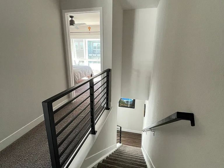 Third floor hallway looking into master bedroom