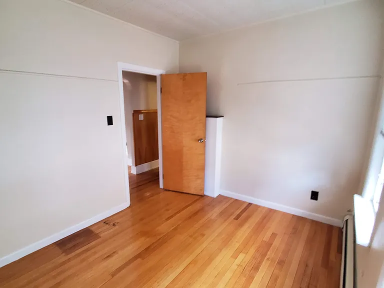 Office off hallway across from dining room, no closet in this room
