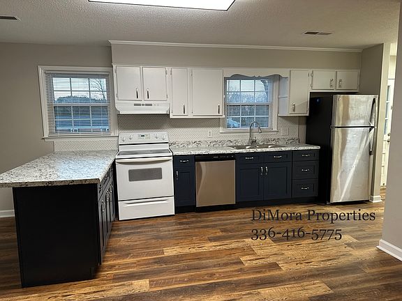 Kitchen with eating bar & Newer lower cabinets and countertops, and flooring