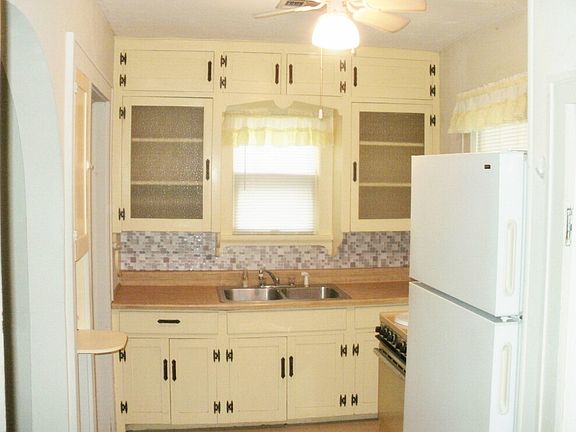 kitchen with utility rm & breakfast nook opening to left.