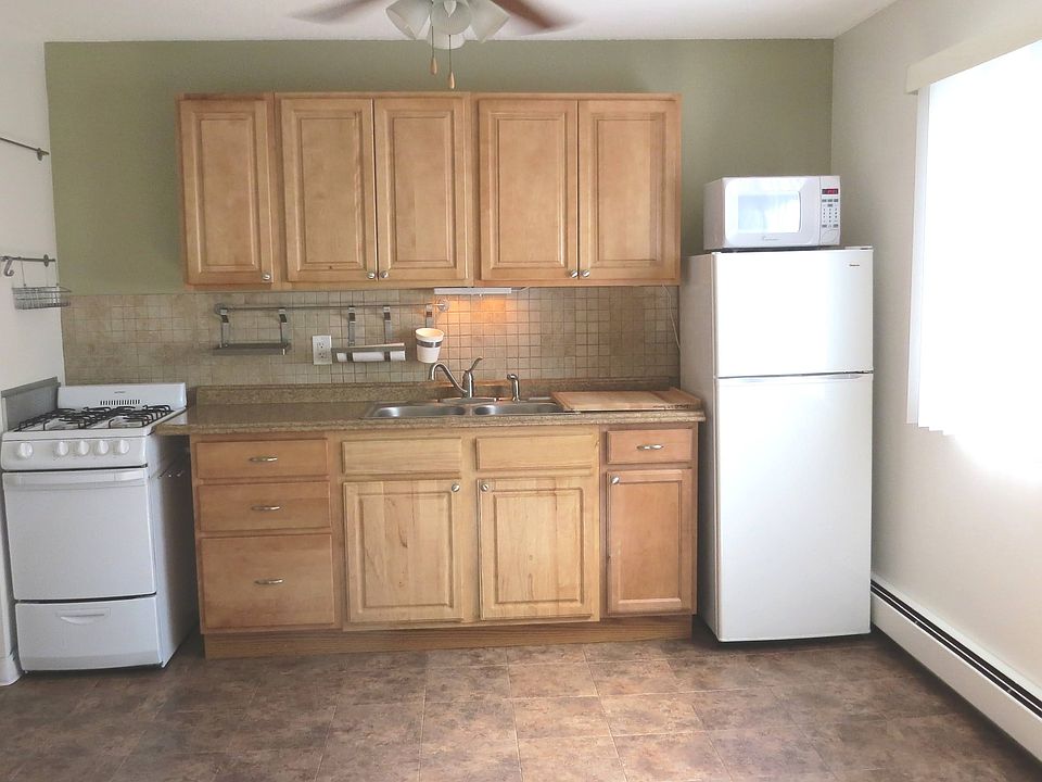 The kitchen has an oversized window and lots of natural light.