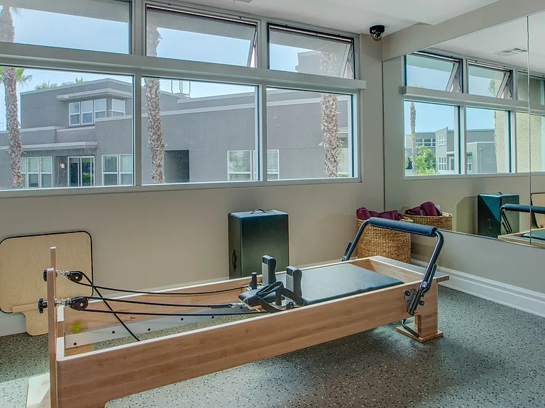 Premier 6,500 square foot fitness center featuring cardio machines with personal TVs