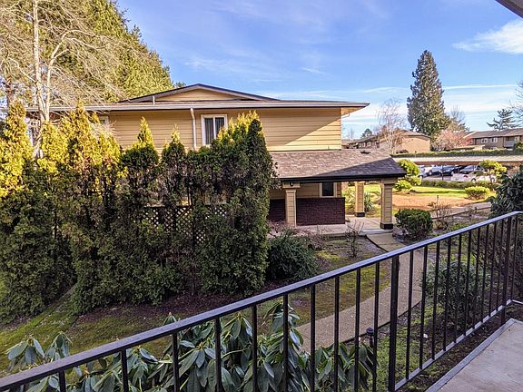 This unit has a very private balcony with a park-like view.