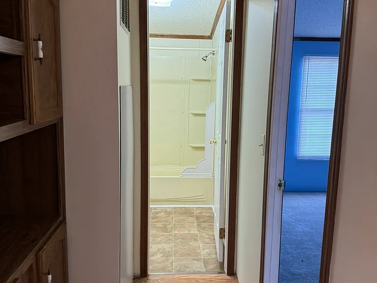 More built in storage hallway to 2nd bath and 3rd bedroom