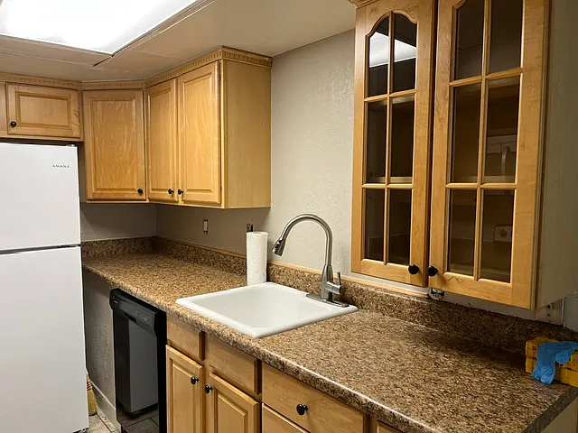 Kitchen with sink & dishwasher and Refrigerator. Garbage Disposal is included.