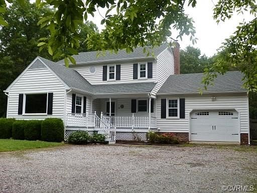 Front with one car garage and storage above