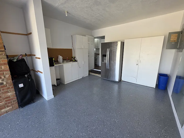 Attached garage leading to kitchen with Second Fridge