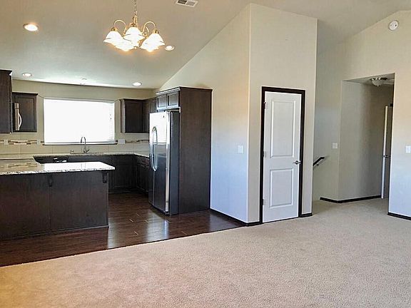 Open kitchen with granite countertop