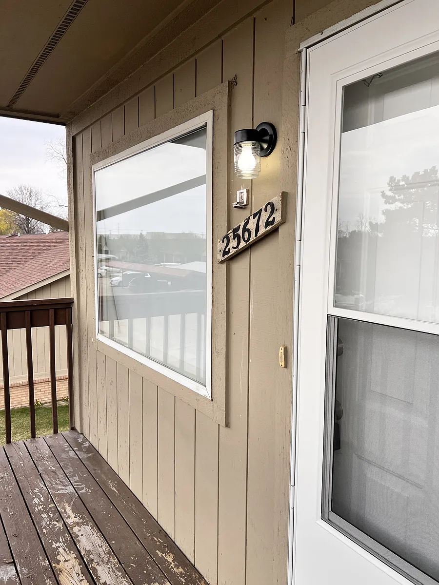 balcony with screen door & working light - 25672 Lira Ln
