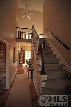 Gracious 2-story foyer leads to living room and dining area.