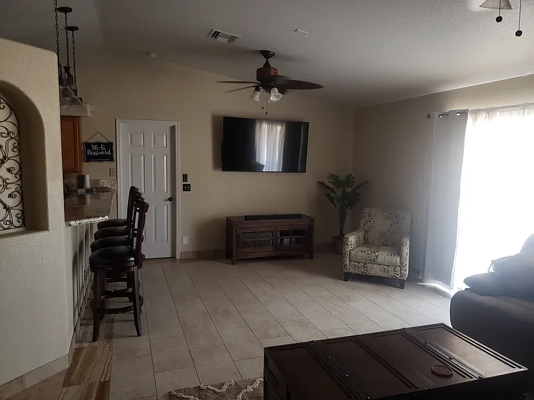 Large living room with huge reclining sectional.