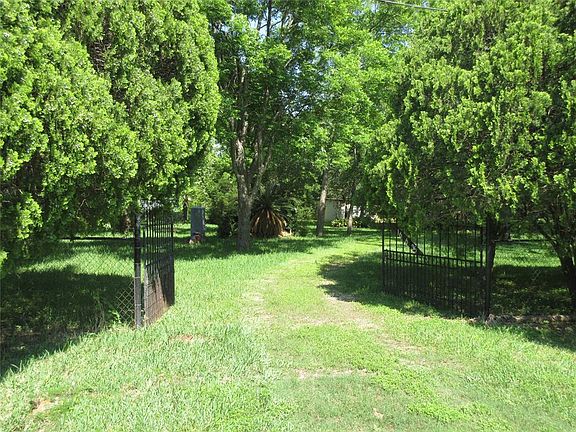 Front gates entering the property from Pecan Drive.