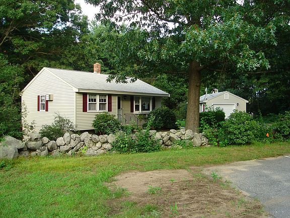 View of house with detached garage