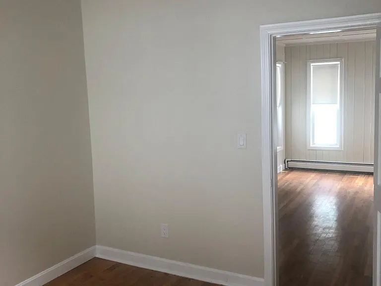 BR with 1/2 Bath looking into living room