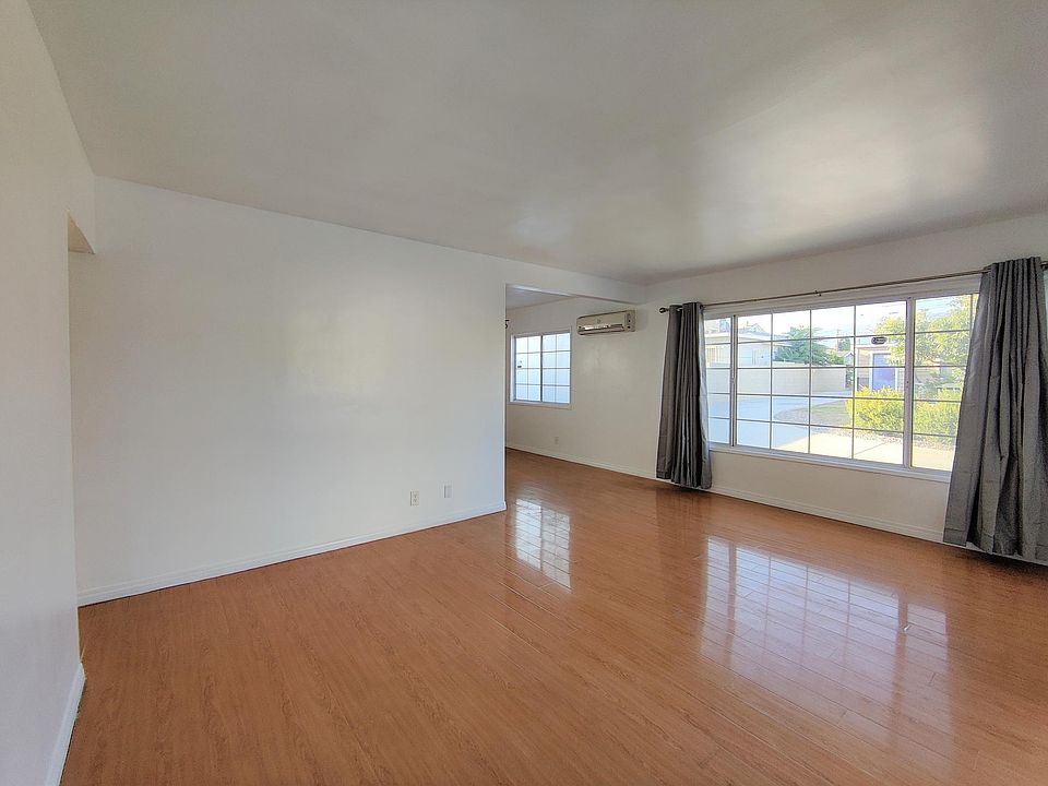Spacious living room with large windows and lots of natural light.